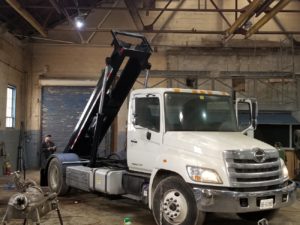 photo of testing a Min roll off in truck made in Ontario by JT Fabrication