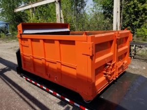 photo of custom containers and flat deck arrangement for a hook bin truck for a toronto firm